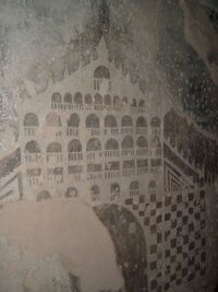 Graffiti veneciano en el interior del castillo de la Atalaya, realizado por un preso de la Guerra de Sucesión mediante la técnica del esgrafiado, es decir, haciendo aparecer en blanco las capas inferiores de la pared y dejando en negro la capa superior, ennegrecida por el humo de las antorchas