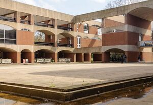 Falmer House inner courtyard showing arches, building levels and divisions and part of inner moat, University of Sussex.jpg